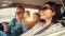 The picture shows a happy family in a car to represent the benefits of Comfort & Savings